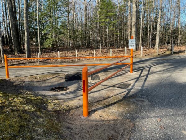 No left turn sign near orange barriers