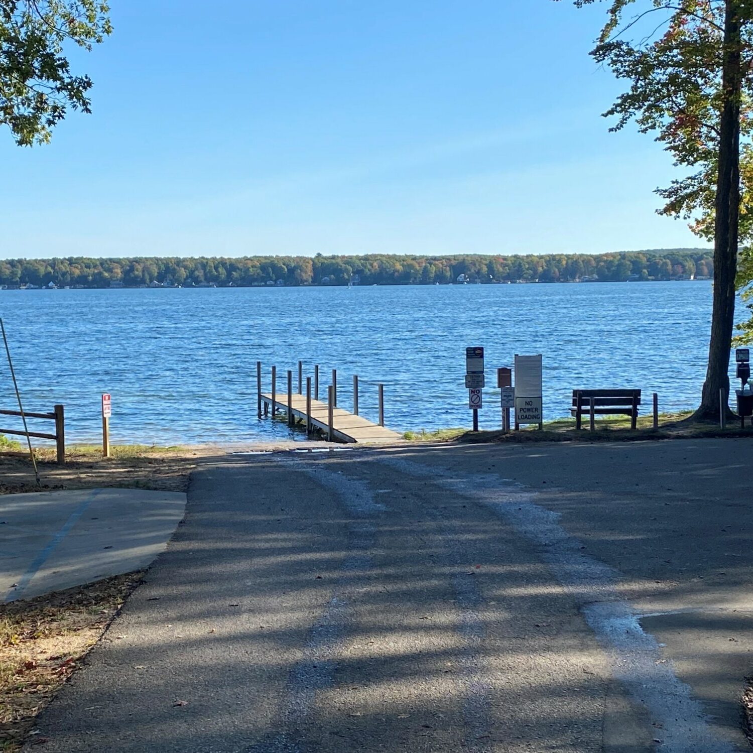 Lake view with dock and trees