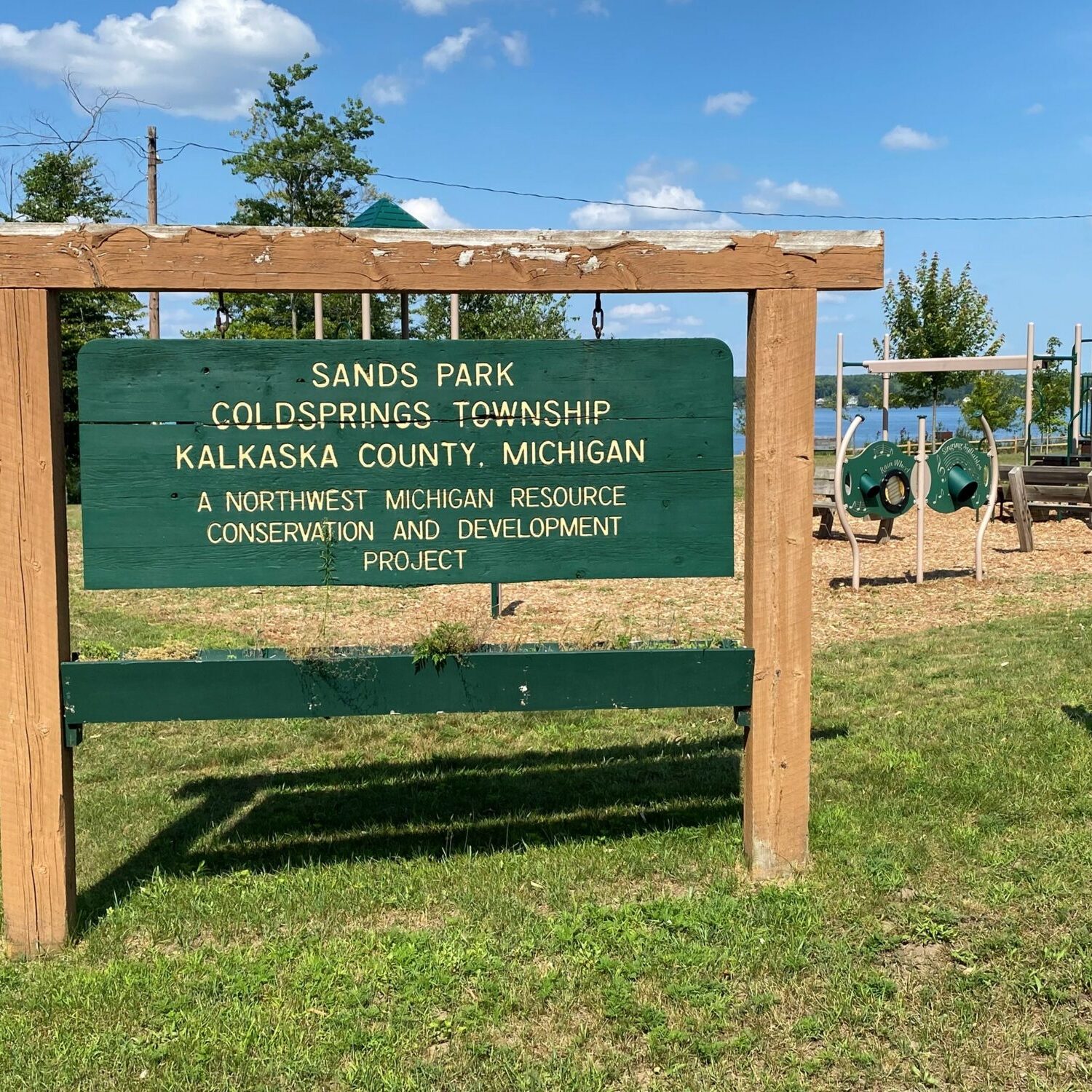 Sands Park sign in Kalkaska County, Michigan playground.